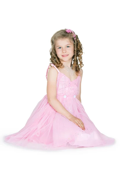 Het meisje in een roze jurk — Stockfoto