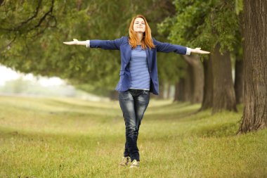 Young fashion girl at spring outdoor. clipart