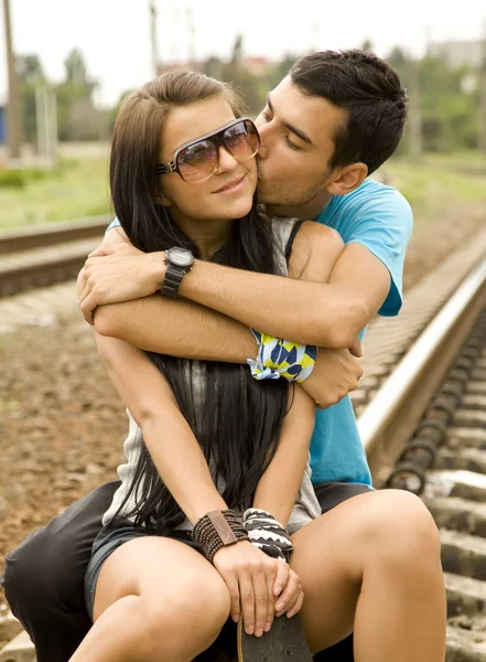 Couple kissing at railway. — Stock Photo, Image