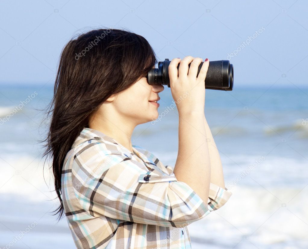 Girl with binocular at the beach. Stock Photo by ©massonforstock 7980522