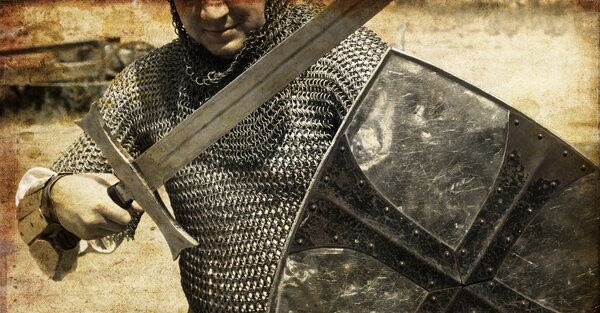 Photo of Knight and sword. Photo in old image style.