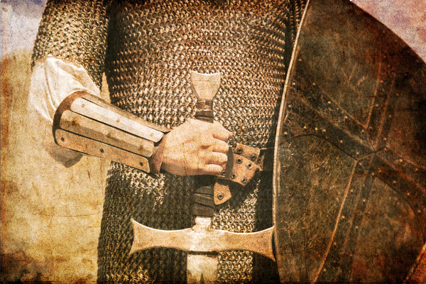 Photo of Knight and sword. Photo in old image style.