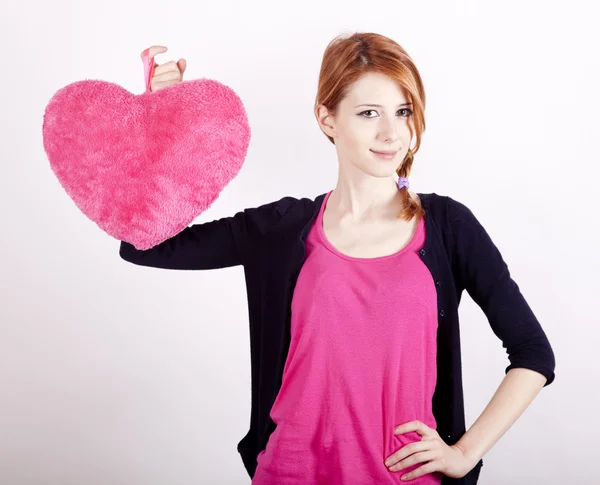 Beautiful red-haired girl with toy heart. Photo for st. Valentin — Stock Photo, Image