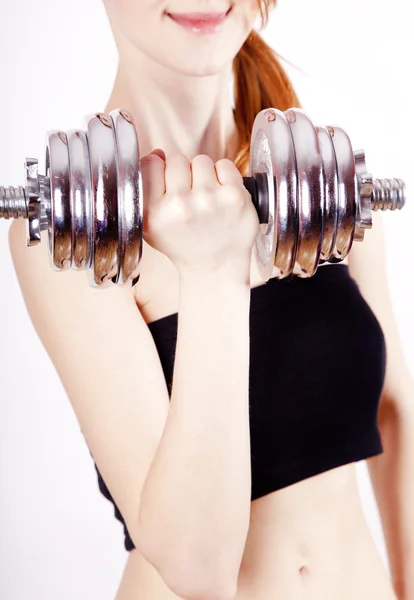 Attractive teenage girl working-out with dumbbells — Stock Photo, Image