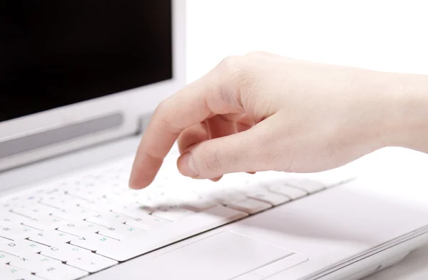 Human hands over laptop keypad during typing. Studio shot. — Stock Photo, Image