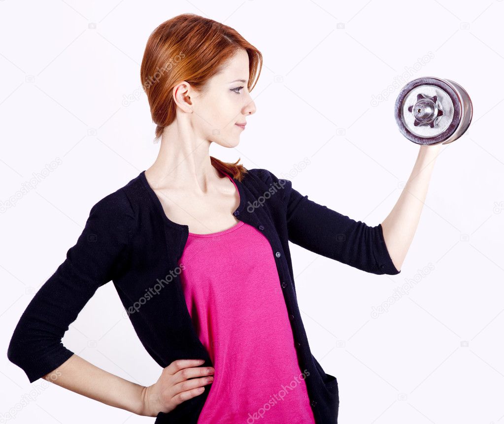 Attractive teenage girl working-out with dumbbells