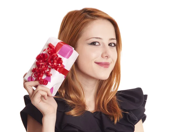 Beautiful red-haired girl with present boxes. — Stock Photo, Image