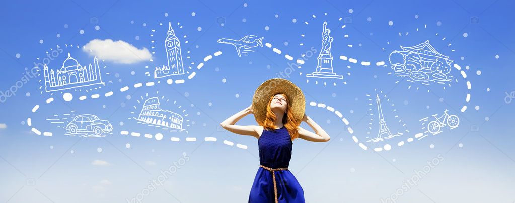 Redhead girl dreaming about traveling around the world.