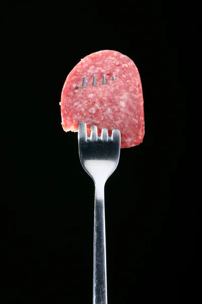 Salami on a fork — Stock Photo, Image