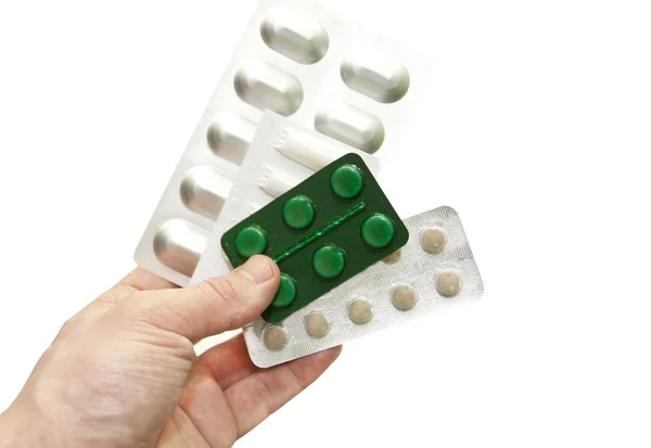 Różne tabletki w ręce lekarza — Zdjęcie stockowe