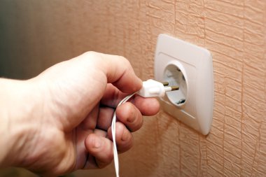 Connection of plug in the socket clipart