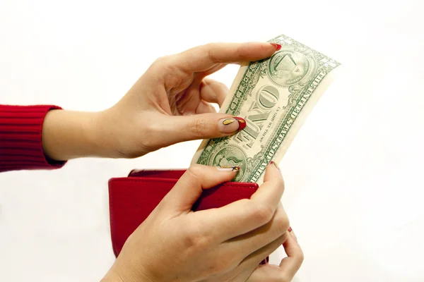 Rote Geldbörse in der Hand mit Dollar — Stockfoto