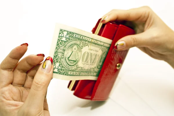 Červená kabelka v rukou s dolarem — Stock fotografie