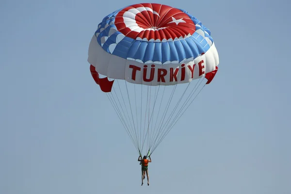 stock image The tourist on a parachute