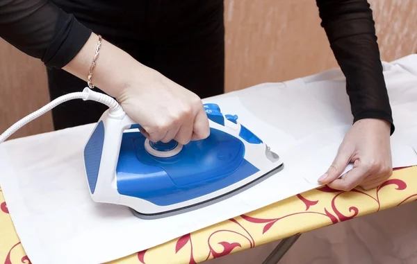 Process of ironing of a white dressing — Stock Photo, Image