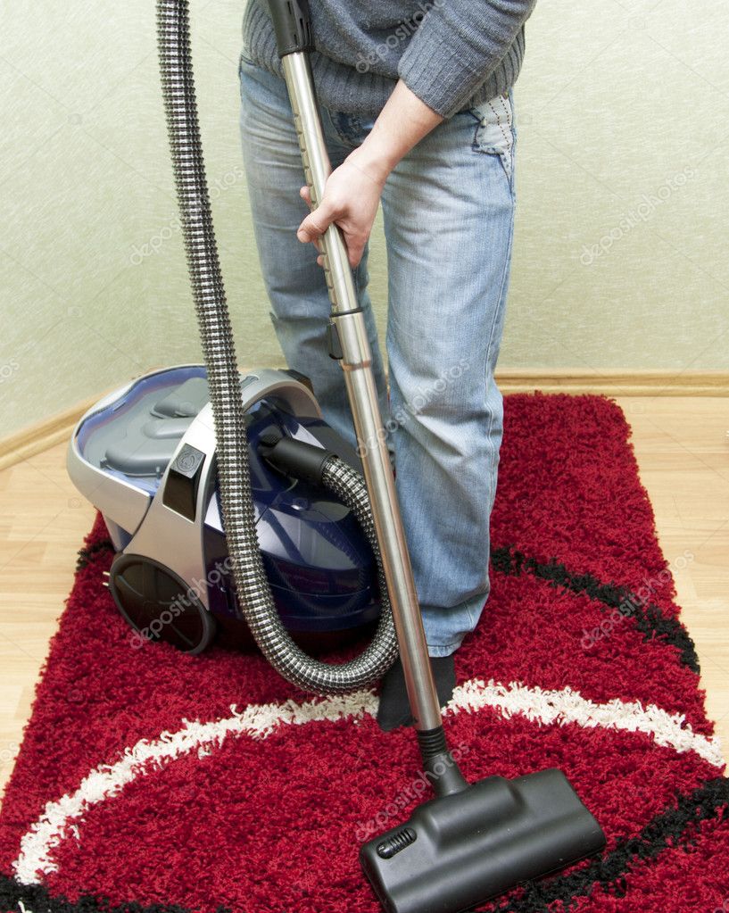 Cleaning by the vacuum cleaner Stock Photo by ©gorvik 9150910