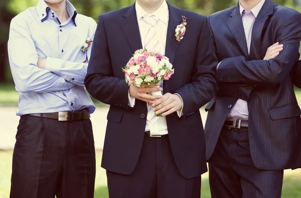 Pink and white wedding bouquet in the hands of the groom — Stock Photo, Image