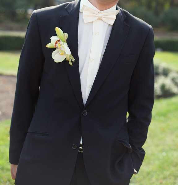 Groom in a wedding jacket with boutonniere