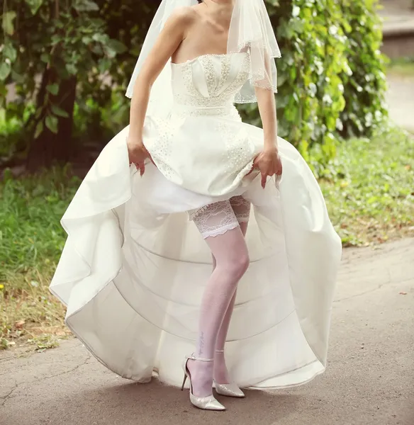 Bride in white stockings — Stock Photo, Image