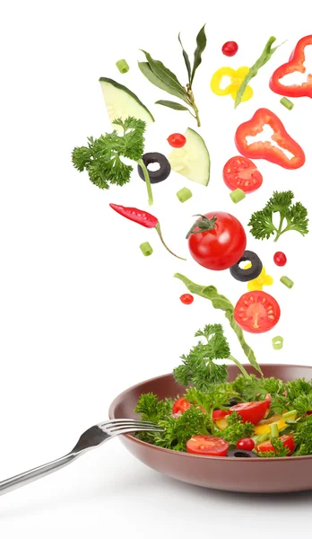 Fresh salad and falling vegetables — Stock Photo, Image