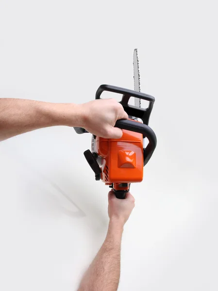 Man hands holding a chainsaw — Stock Photo, Image