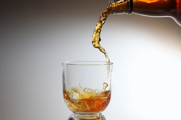 stock image Whiskey being poured into a glass