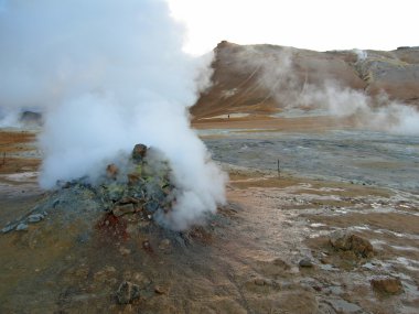 Erupting geyser of steam, Iceland clipart