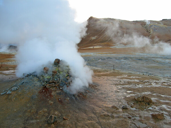 Erupting geyser of steam, Iceland