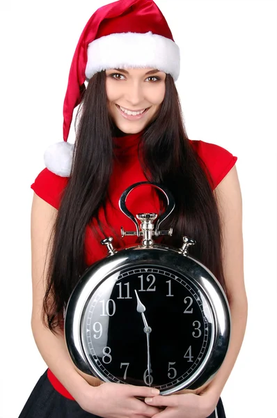 Junge glückliche Weihnachtsfrau hält Uhr — Stockfoto