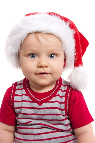 Adorable niño de Navidad en un sombrero rojo —  Fotos de Stock