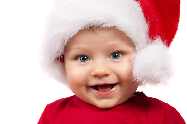 Очаровательный рождественский ребенок в красной шляпе — стоковое фото