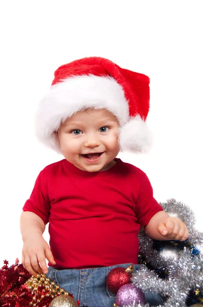 Adorable niño de Navidad en un sombrero rojo — Foto de Stock