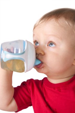 Baby drinking juice from bottle clipart