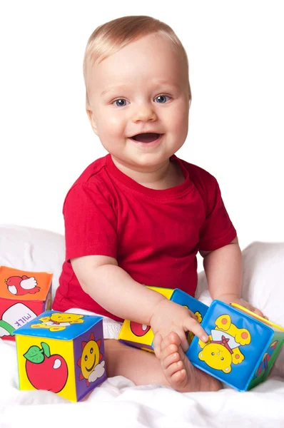 Αξιολάτρευτο μωρό αγόρι με πολύχρωμο μπλοκ — Φωτογραφία Αρχείου
