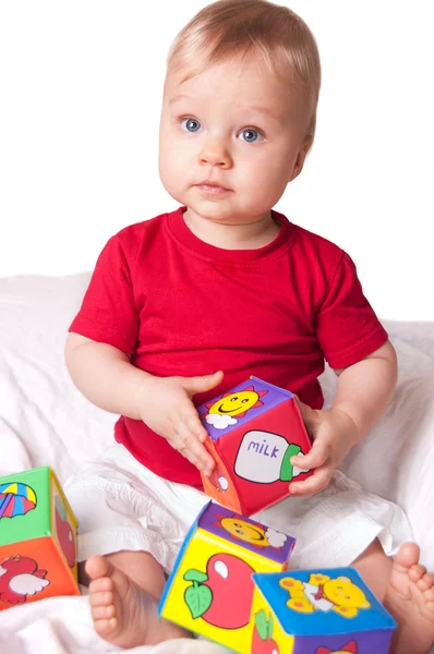 Adorable baby boy with colorful blocks — Stock Photo, Image