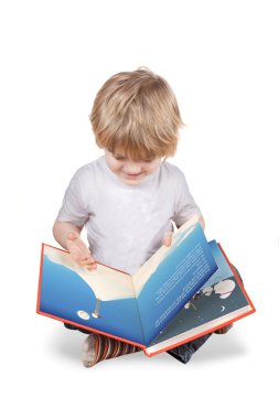 Boy sitting reading a big picture book clipart