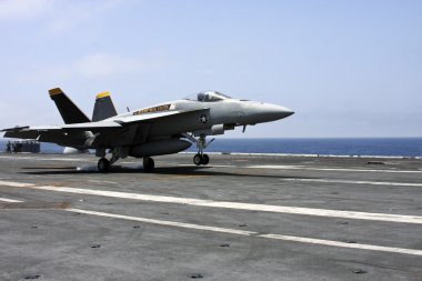 Carrier landing of navy jet clipart