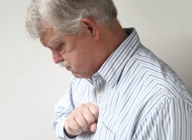 Senior man suffers from bad heartburn clipart