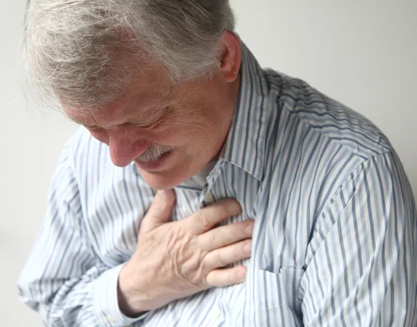 Людина з сильним болем у грудях Ліцензійні Стокові Фото