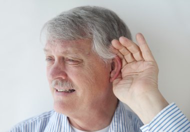 Mature man has trouble hearing clipart