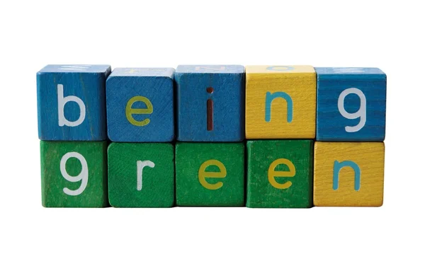 Grün sein in Blockbuchstaben — Stockfoto