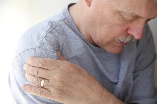 Shoulder pain in a senior man — Stock Photo, Image