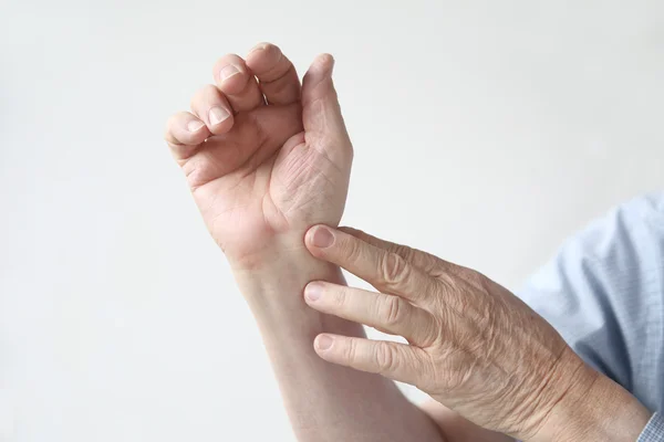 Man with an aching wrist Stock Photo