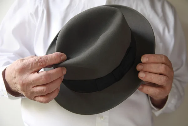 stock image Businessman with an old felt hat