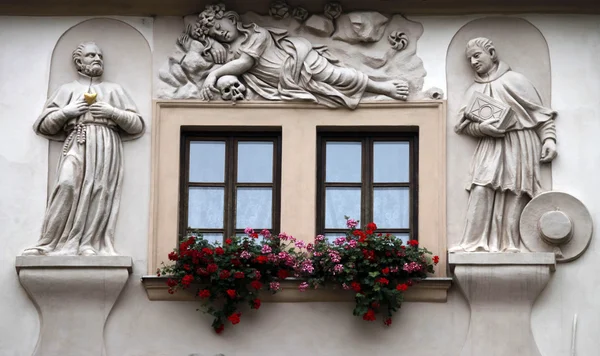 Stock image Saints on facade, House of the Golden Well, Prague,