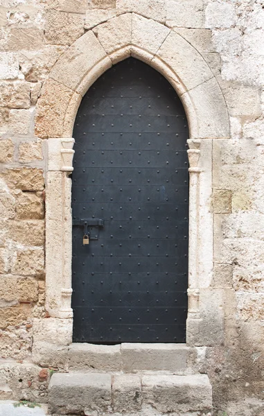 Old black medieval door with sliding door bolt — Stock Photo, Image