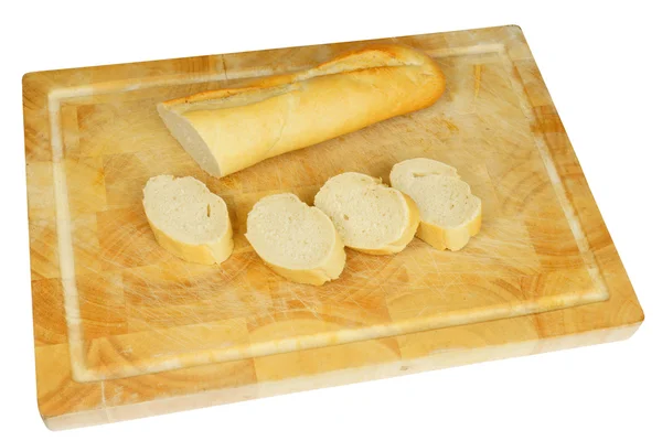 Träplatta med franskt bröd — Stockfoto