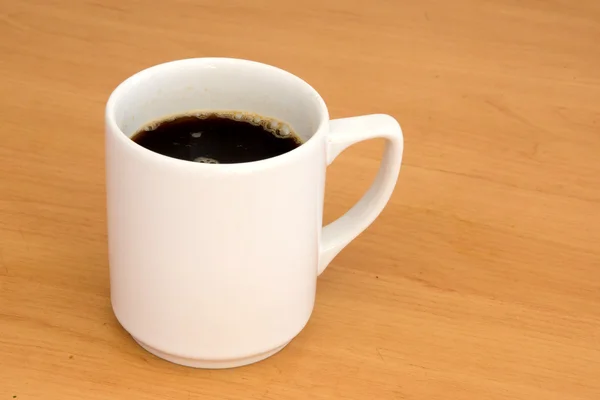 Xícara de café em uma mesa — Fotografia de Stock