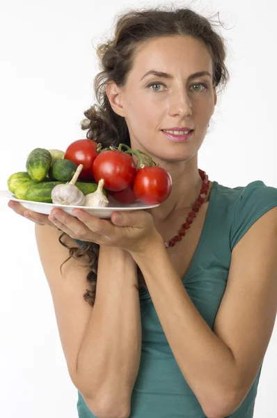 Portrait of a young beautiful woman with vegetables — Stock Photo, Image