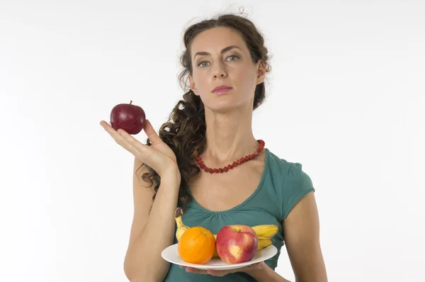 Young beautiful woman with fruit in his hands Royalty Free Stock Images
